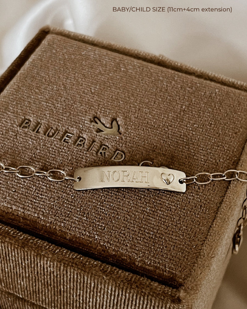 Baby-size 9k Gold Darling Bracelet with heart detail and engraved plate on Bluebird Co jewellery box