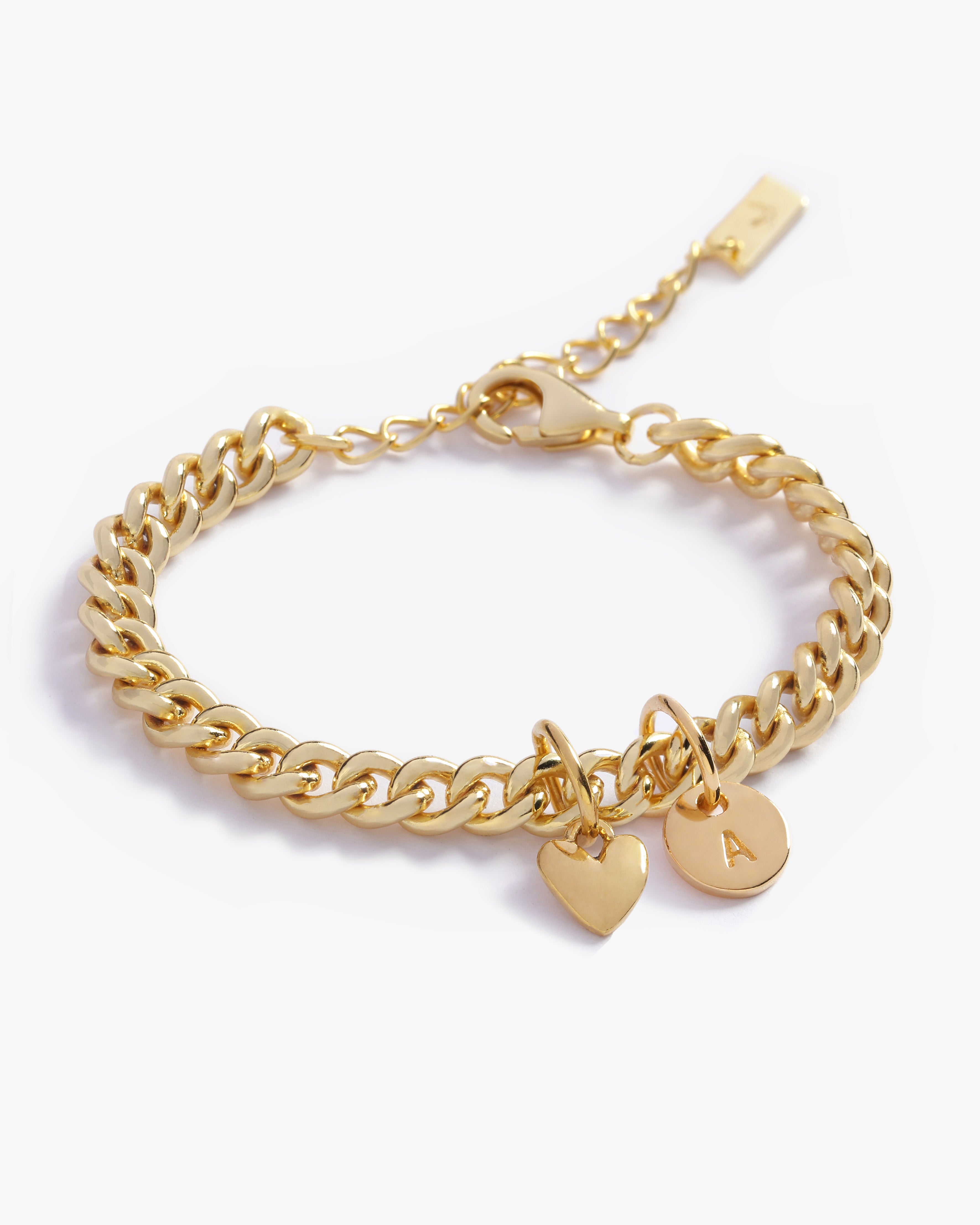 A detailed image of a gold Sweetheart Cuban Link Chain Ankley with a heart charm and engraved initial pendant, designed as elegant personalised jewellery.