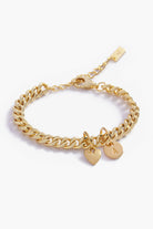 A detailed image of a gold Sweetheart Cuban Link Chain Ankley with a heart charm and engraved initial pendant, designed as elegant personalised jewellery.