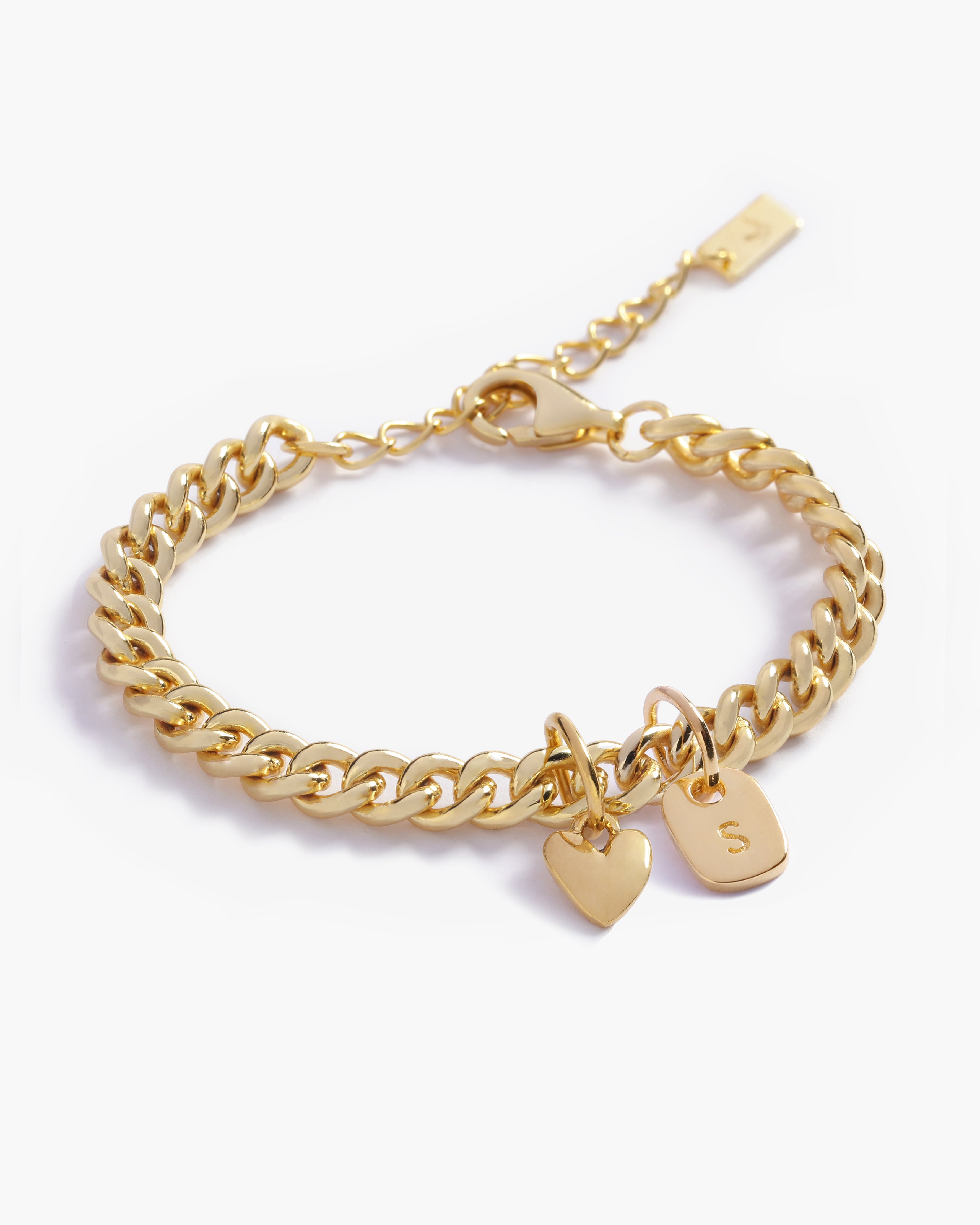 A detailed image of a Sweetheart Cuban Link Chain Anklet featuring a polished heart charm and personalised soild gold rectangular pendant, crafted as a meaningful fine jewellery piece.