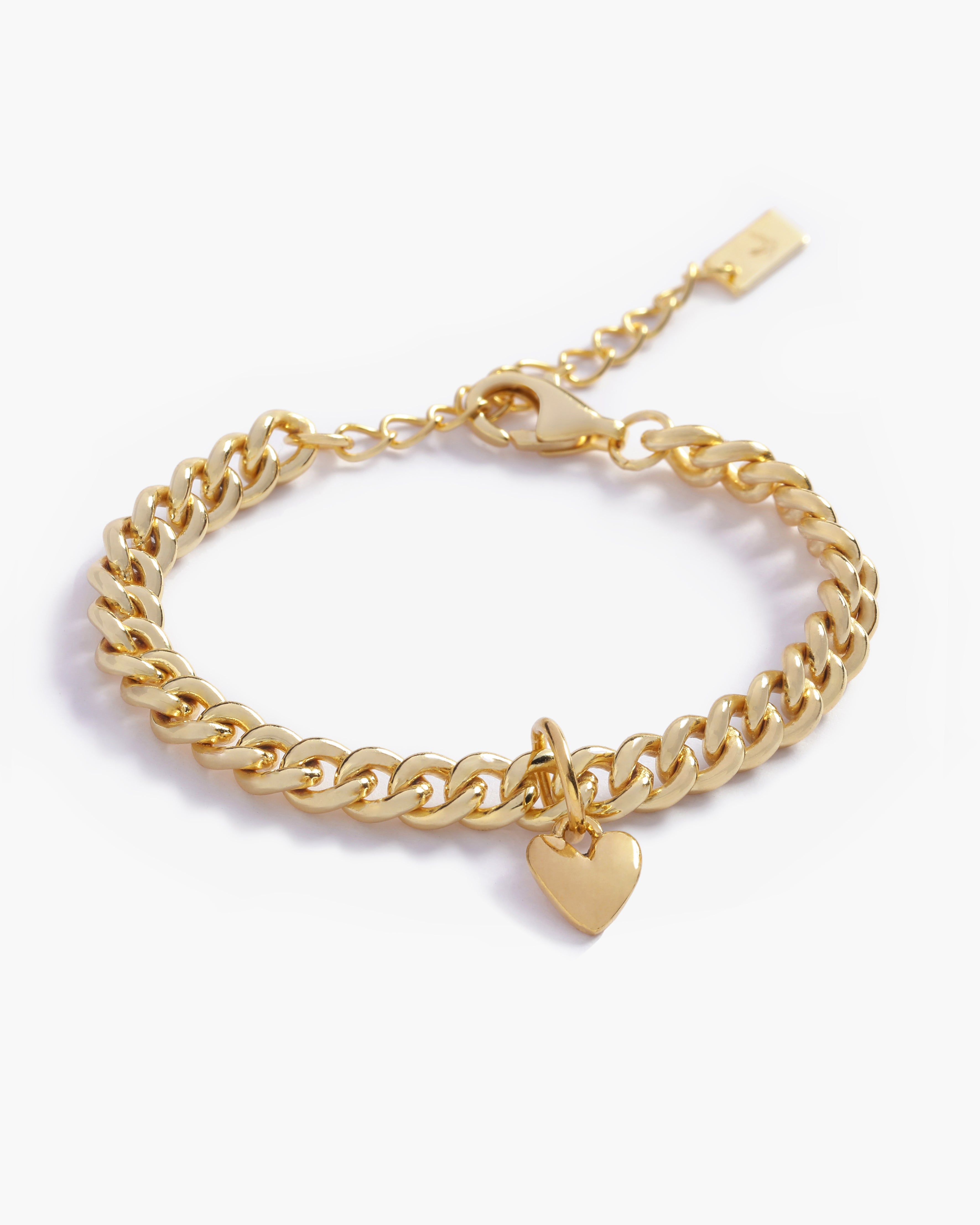 A gold Sweetheart Cuban Link Chain Bracelet featuring a polished heart charm, crafted as a modern and elegant fine jewellery piece by Bluebird Co