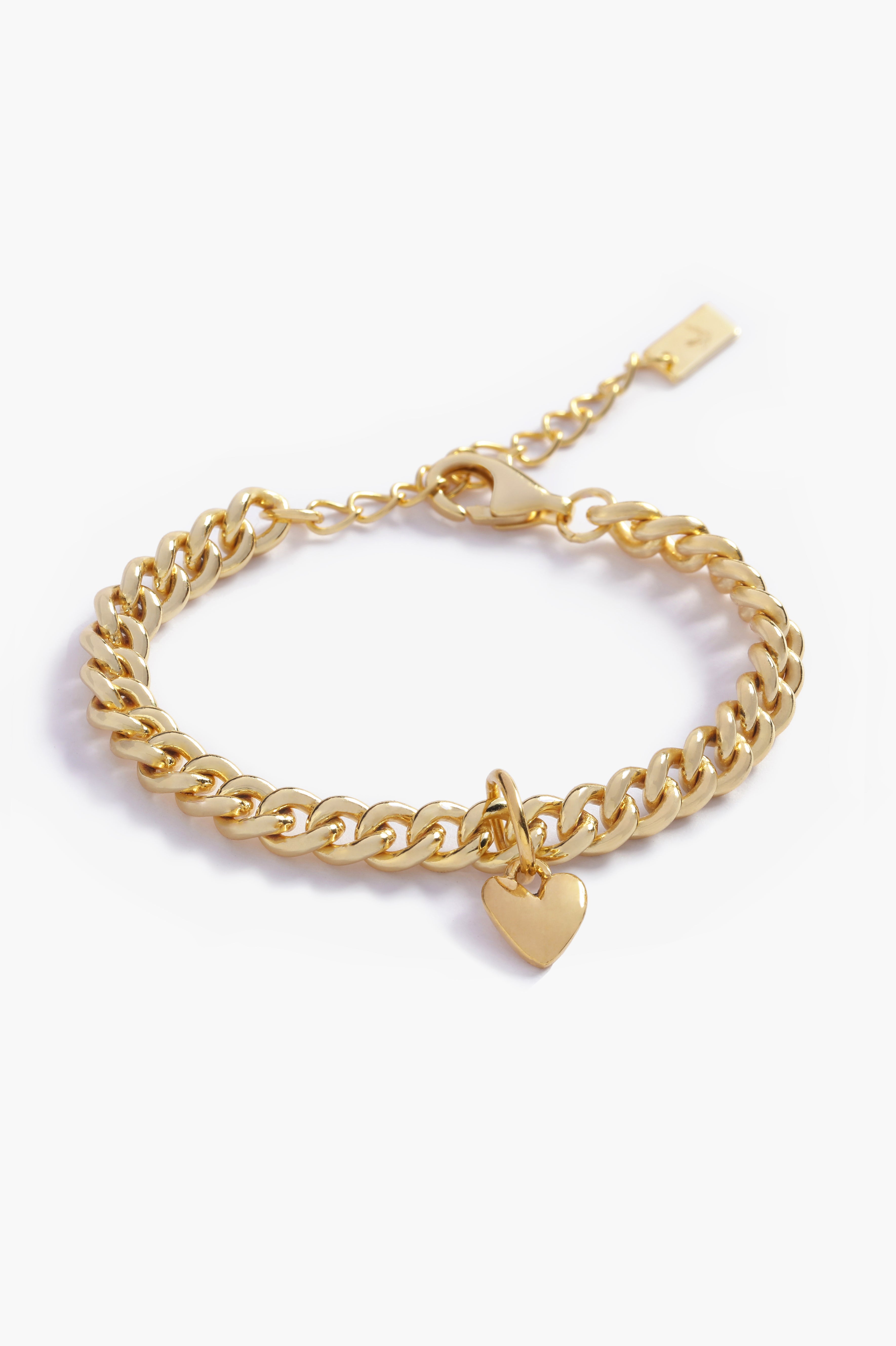 A gold Sweetheart Cuban Link Chain Bracelet featuring a polished heart charm, crafted as a modern and elegant fine jewellery piece by Bluebird Co