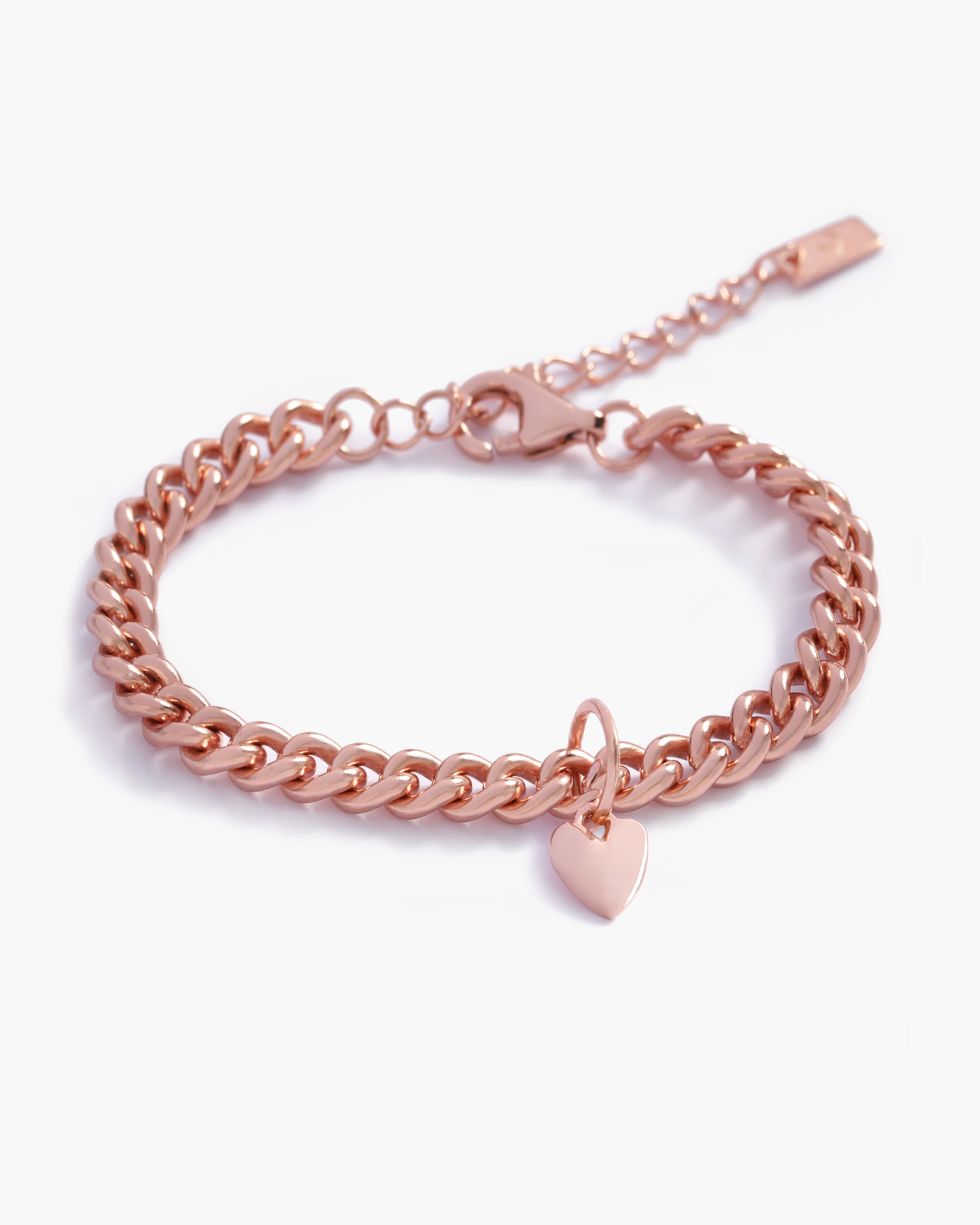 A rose gold Sweetheart Cuban Link Chain Bracelet featuring a polished heart charm, crafted as a modern and elegant fine jewellery piece by Bluebird Co