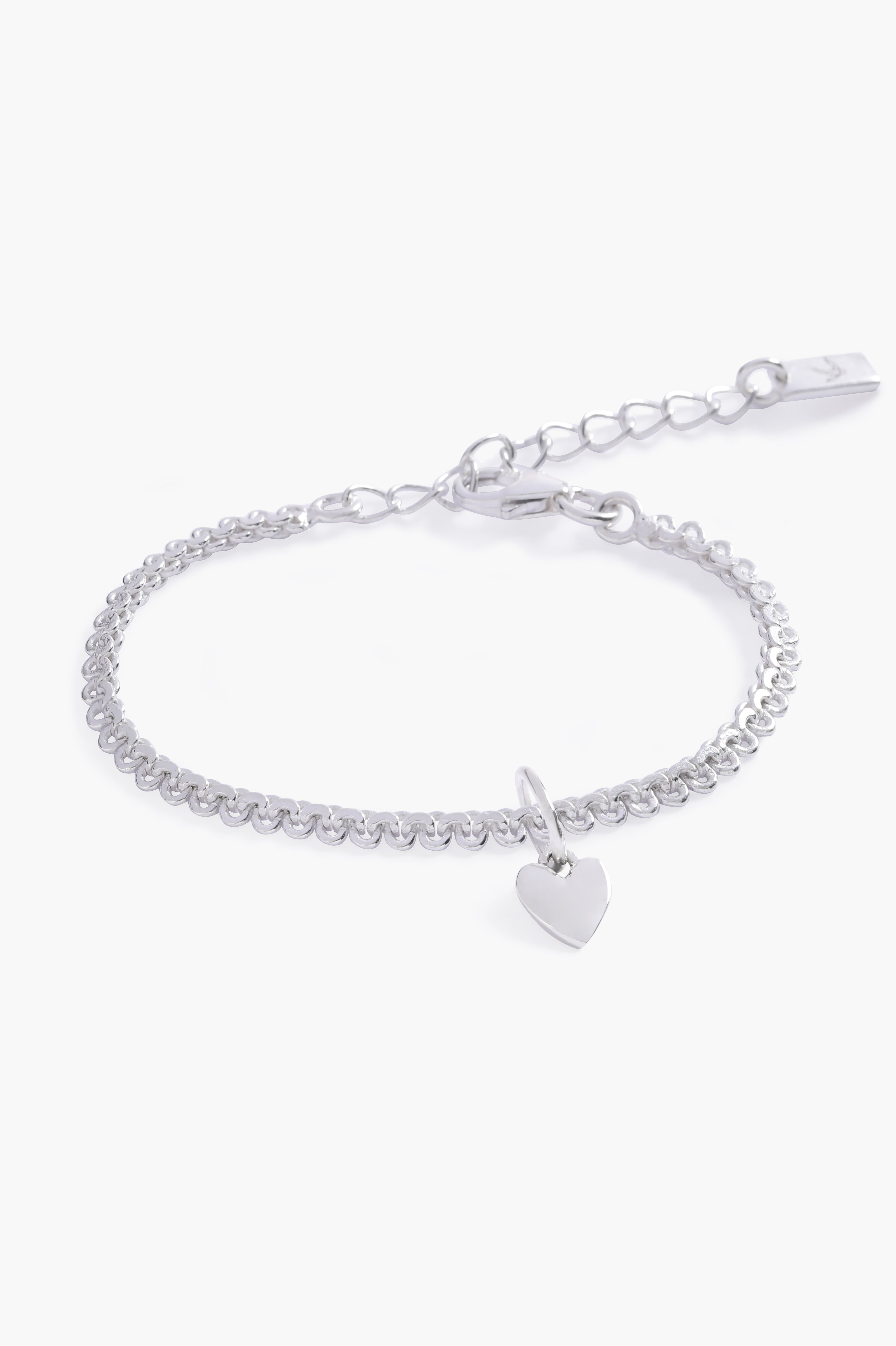 A detailed image of the silver Sweetheart Lace Chain Bracelet with a heart charm, designed with lace-inspired links for a delicate finish by Bluebird Jewellery