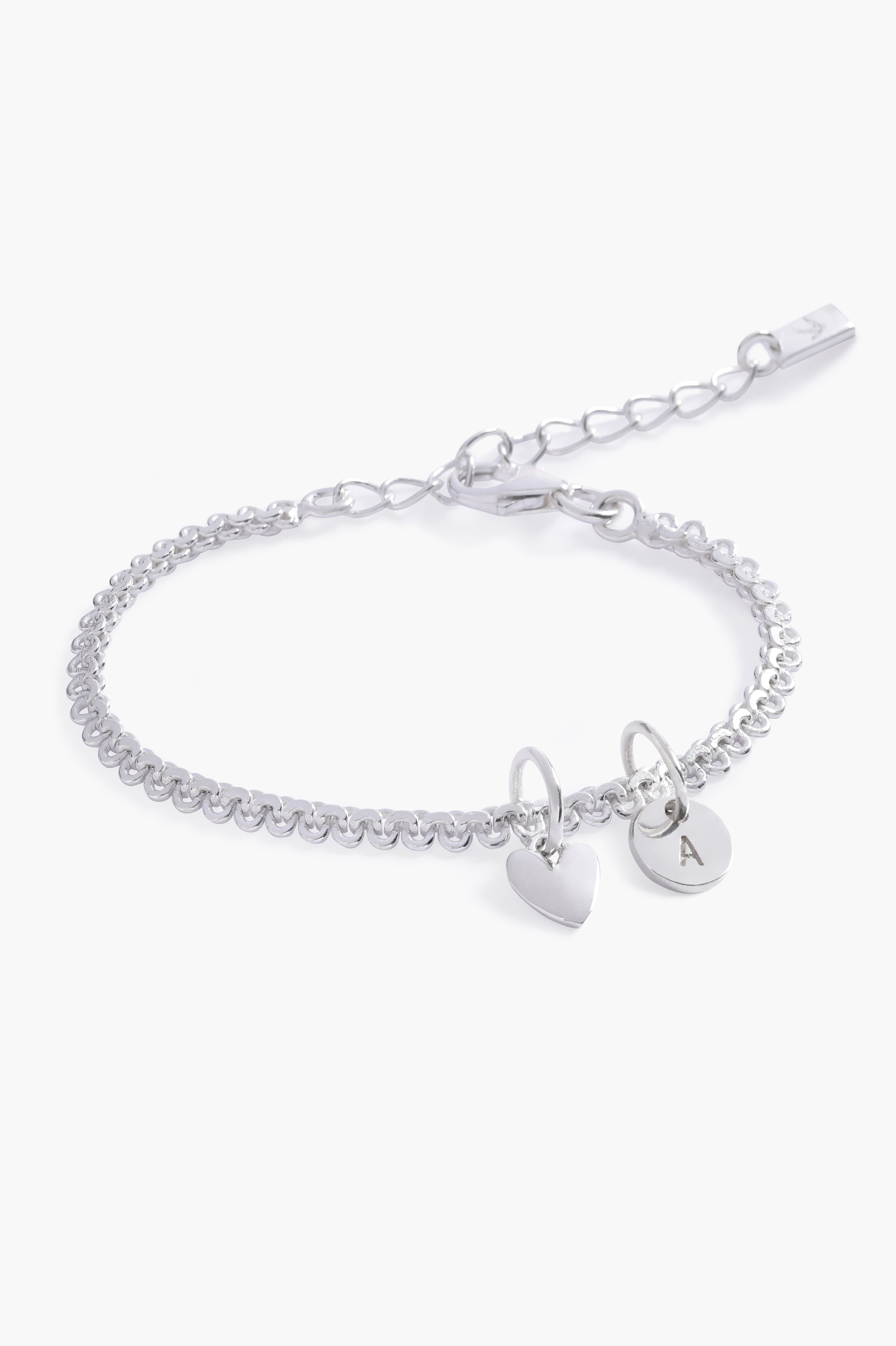 A delicate Lace Chain Bracelet with a heart charm and engraved initial pendant, designed as timeless personalised jewellery.