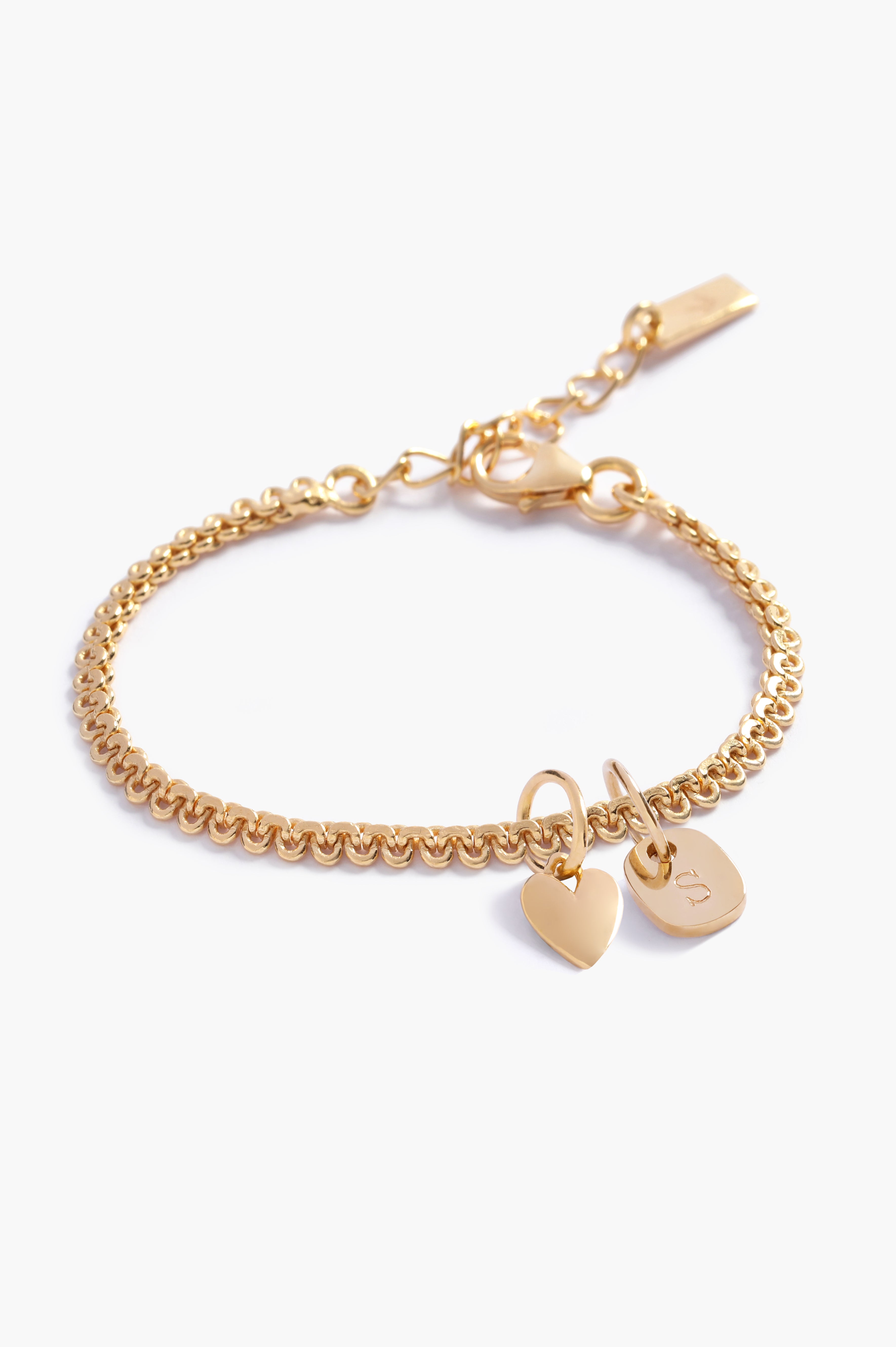 A personalised Lace Chain Bracelet featuring a heart charm and soild gold mini rectangular initial pendant, designed as an elegant fine jewellery gift for all ages by Bluebird Co
