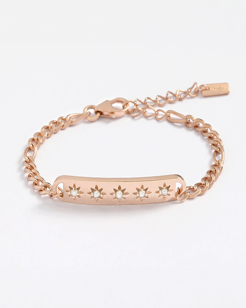 The Darling Heart Bracelet in rose gold by Bluebird Jewellery, featuring five petite hearts along a delicate chain, crafted as an elegant and timeless piece.
