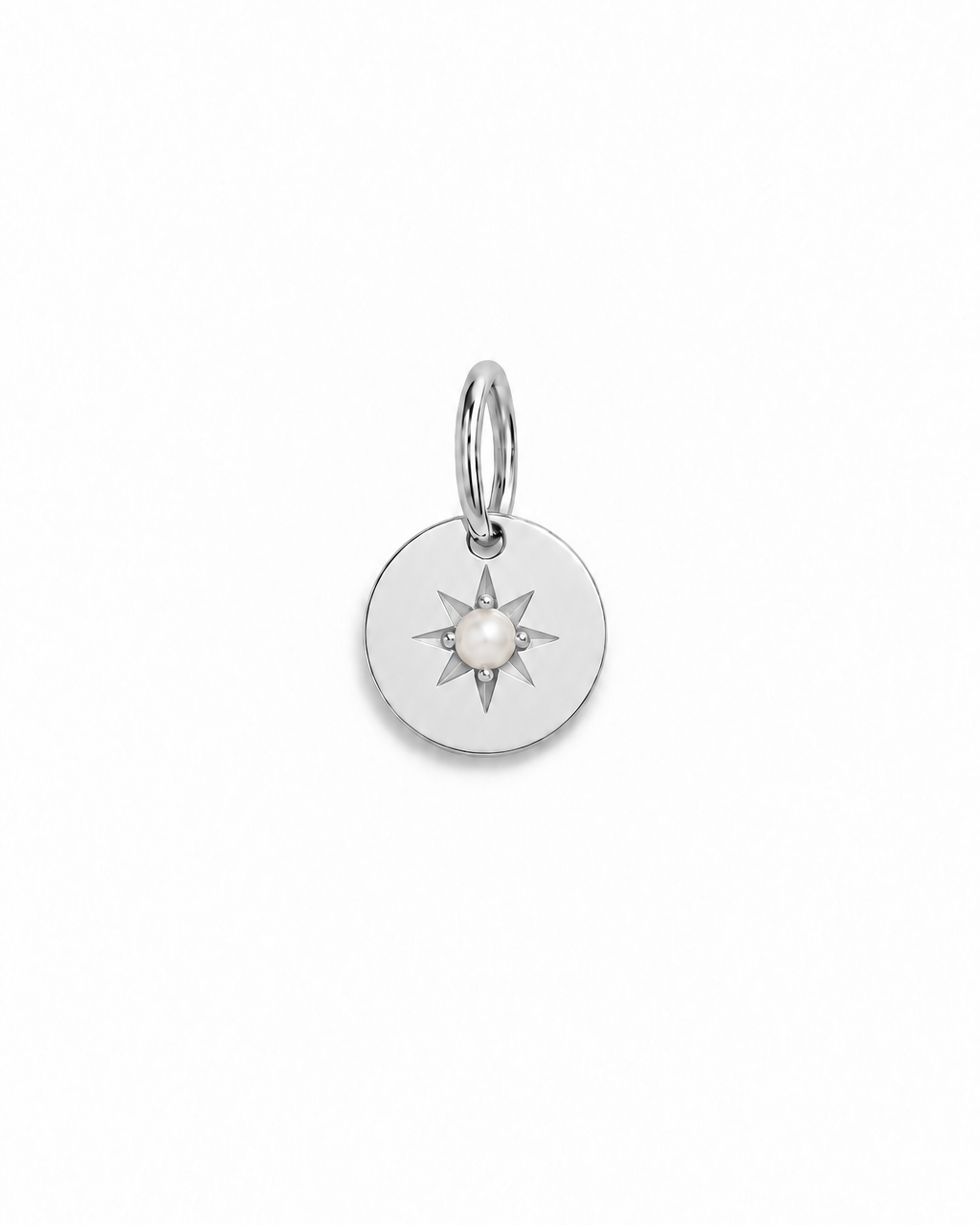 A silver vintage inspired pendant with seed pearl at its centre.
