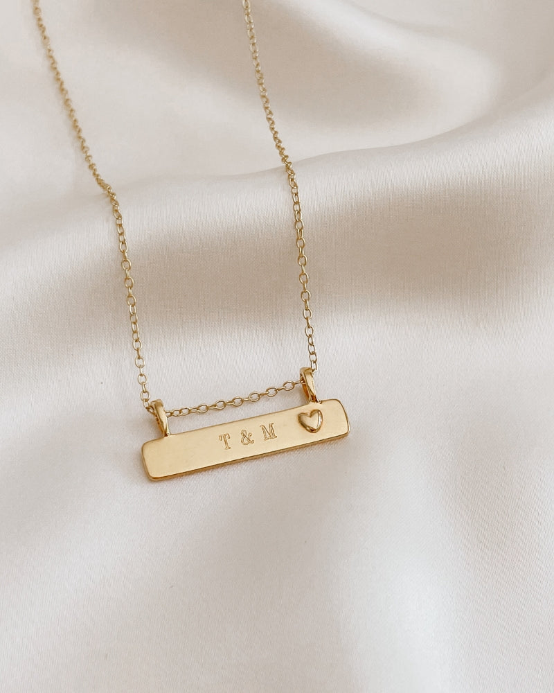 Engraved Darling Bar Necklace Gold with delicate heart pendant on fine chain.