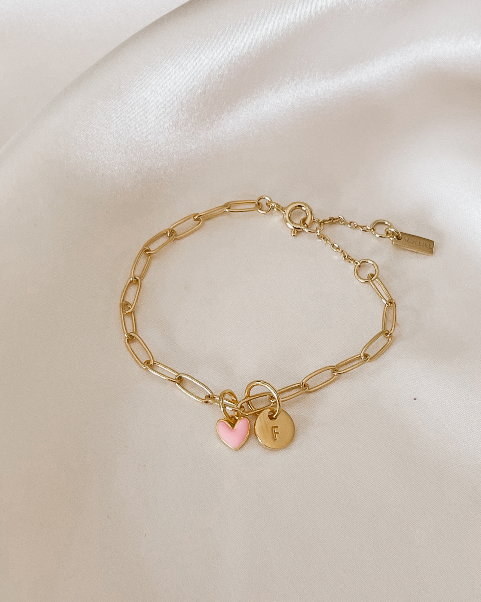 Darling Posie Bracelet Gold with engraved disc and pink heart charm, a special personalised jewellery gift by Bluebird Jewellery.