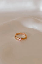 Side angle of Darling Ring Rose Gold with a pink enamel heart.