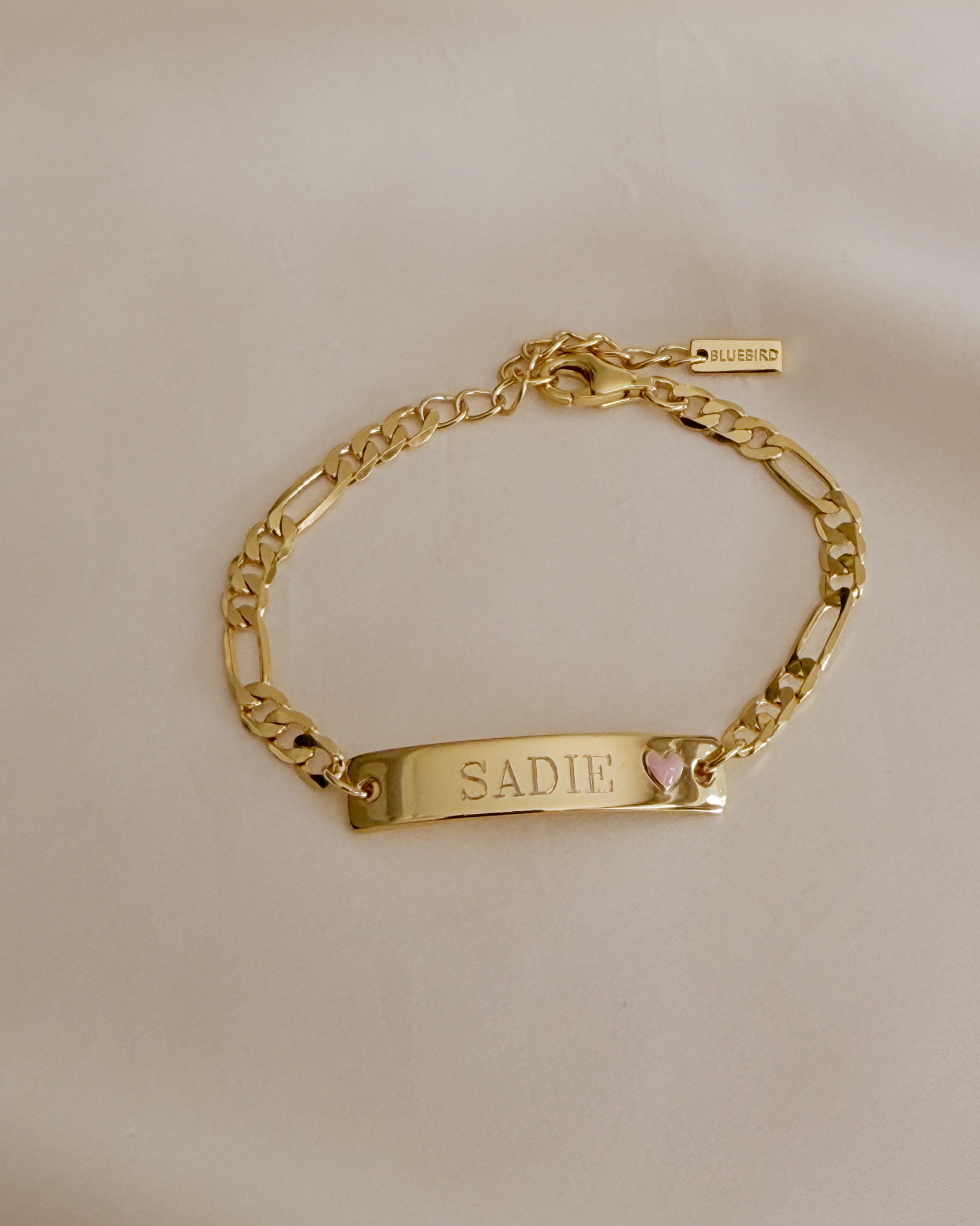 Engraved Pink Darling Gold bracelet with pink heart—personalised jewellery for babies, children, or meaningful gifting by Bluebird Jewellery.