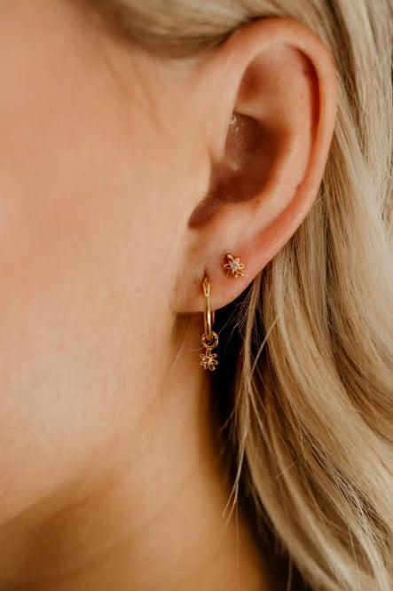 A Petite Daisy Hoop is worn with a Petite Daisy Stud