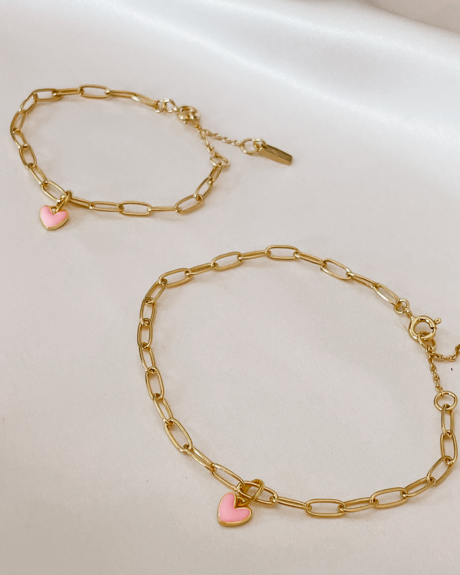 Matching Darling Posie Bracelets Gold with pink heart charms, designed for babies, children, and adults by Bluebird Jewellery