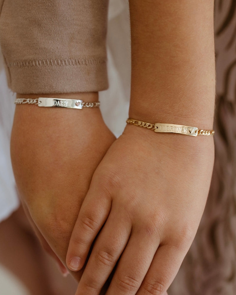 Matching Pink Darling Bracelets in silver and gold—engraved for siblings, friends, or milestone gift giving by Bluebird Jewellery.