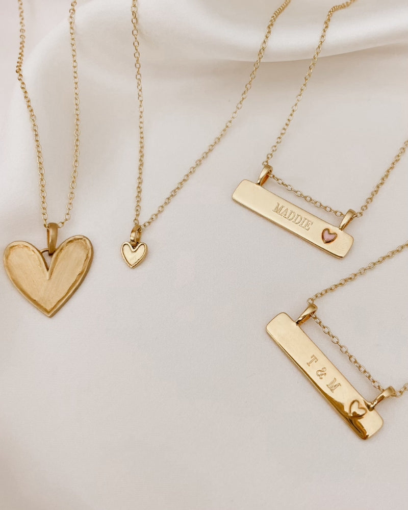 Petite Darling Necklace alongside engraved pieces, a heartfelt jewellery set.
