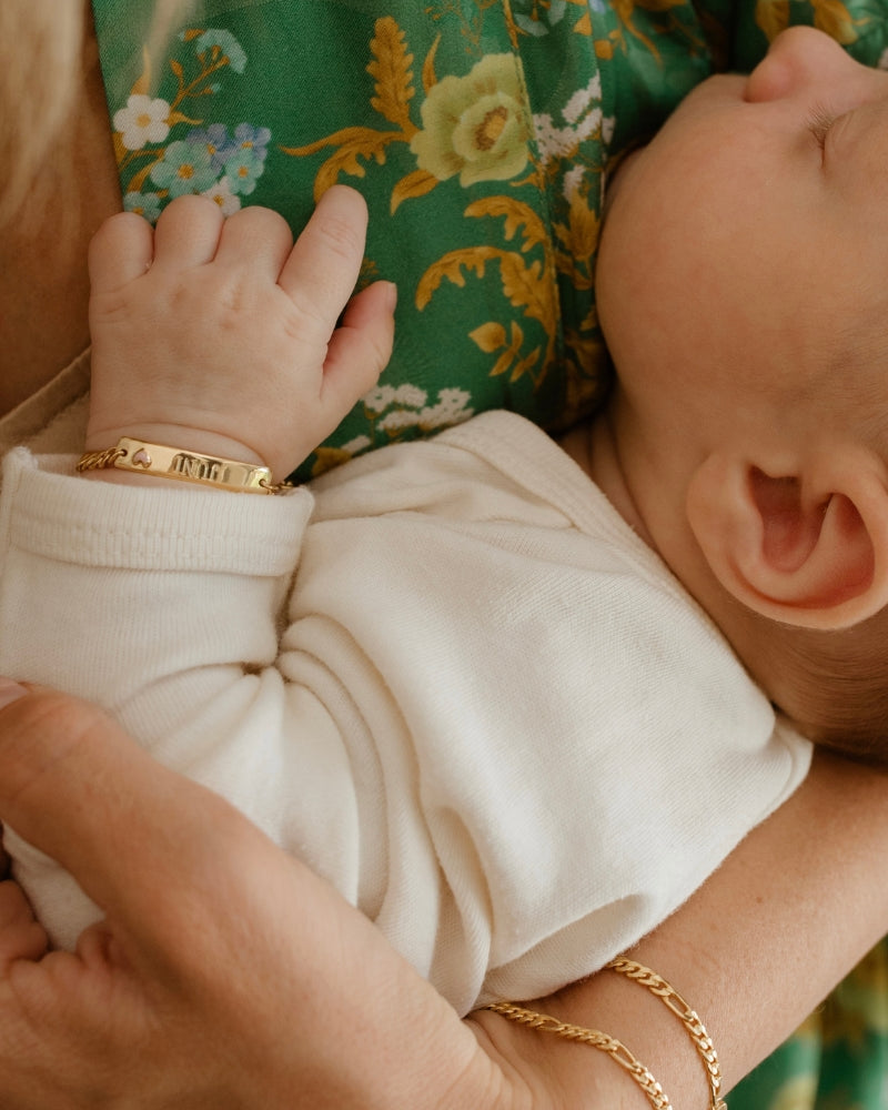 Baby wearing Pink Darling Gold bracelet—engraved jewellery for newborn, memory-making, and love by Bluebird Jewellery.