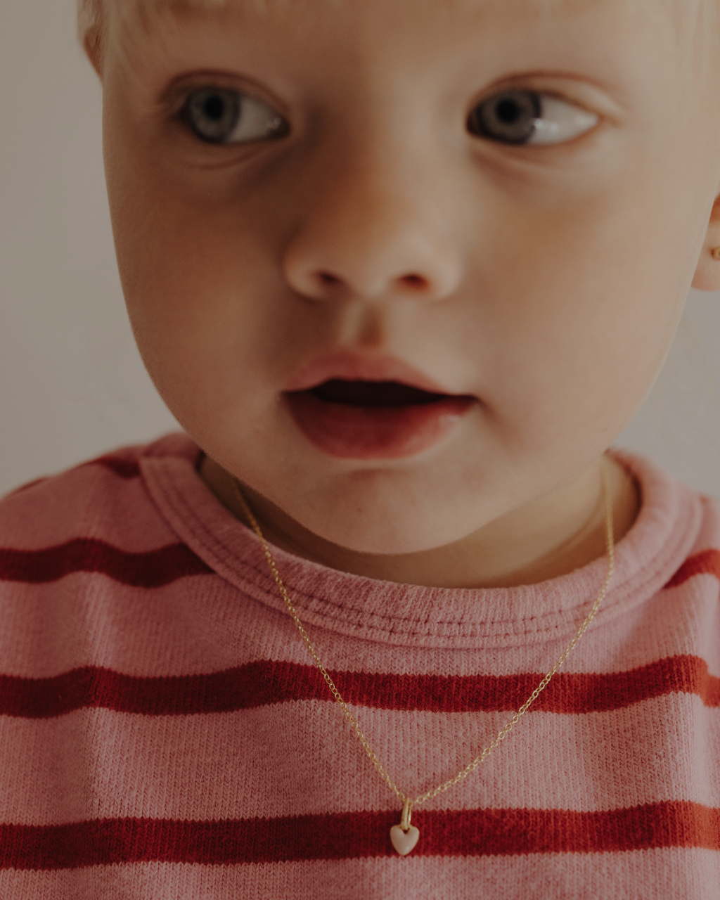 Toddler wearing pink petite Darling Necklace Gold