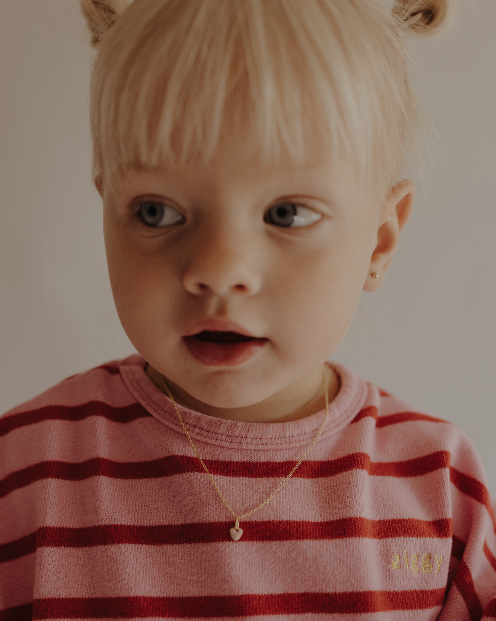 Toddler wearing pink petite Darling Necklace Gold