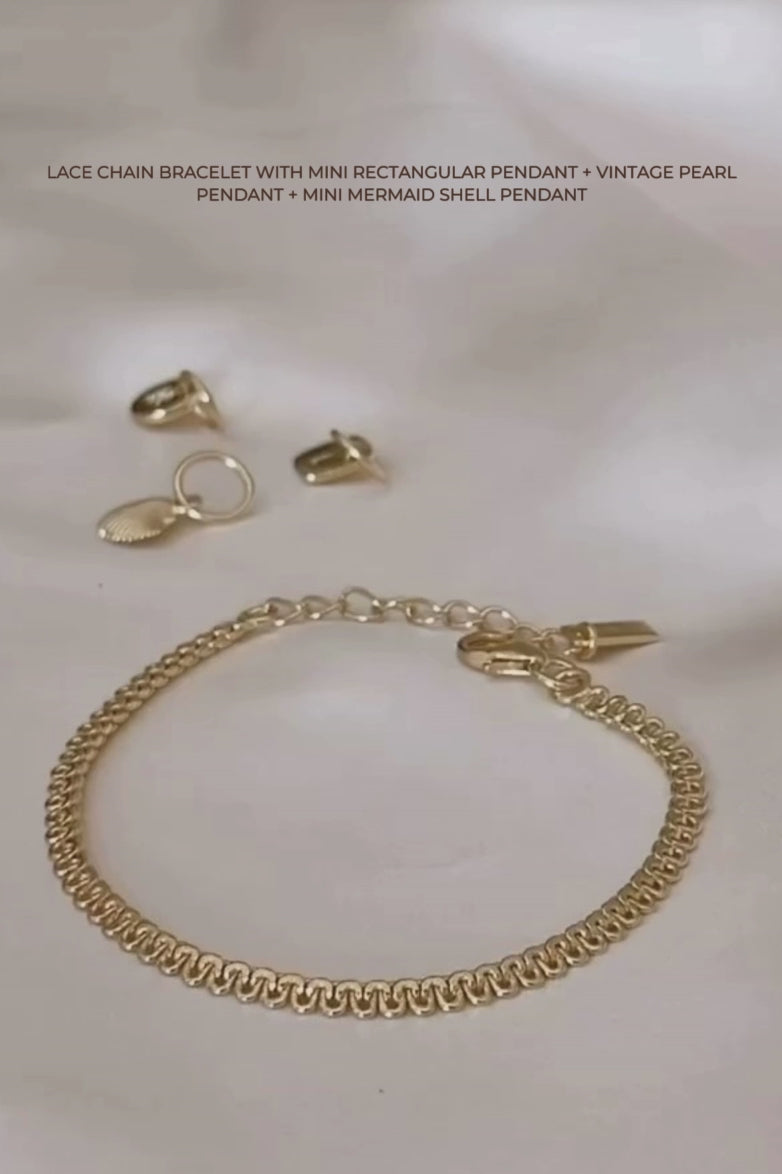 A video tutorial showing how to style the Lace Chain with personalised charms and pendants, creating an elegant layered look.