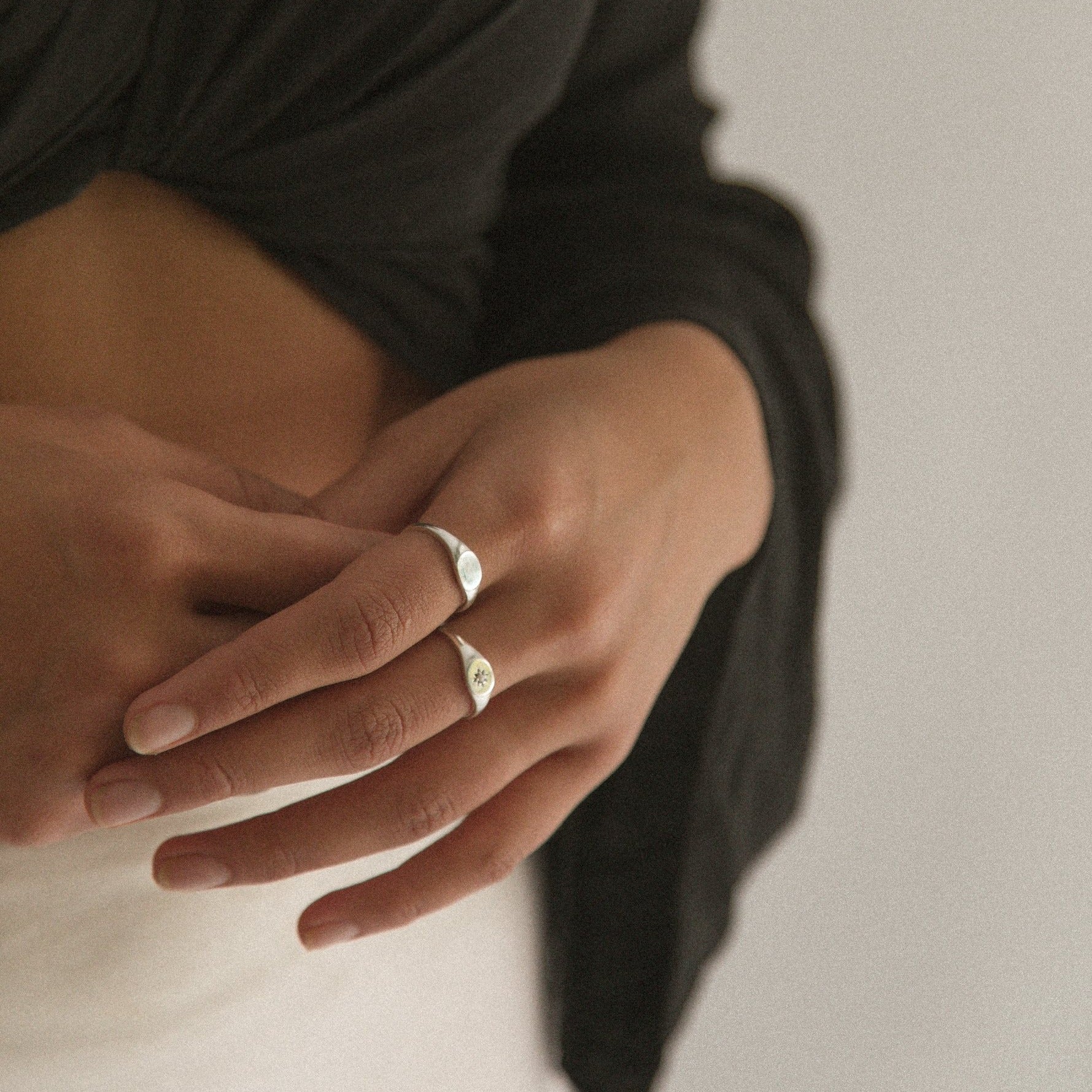 Signet Ring without engraving is worn on a pointer finger in size 7. The ring looks timeless and elegant.