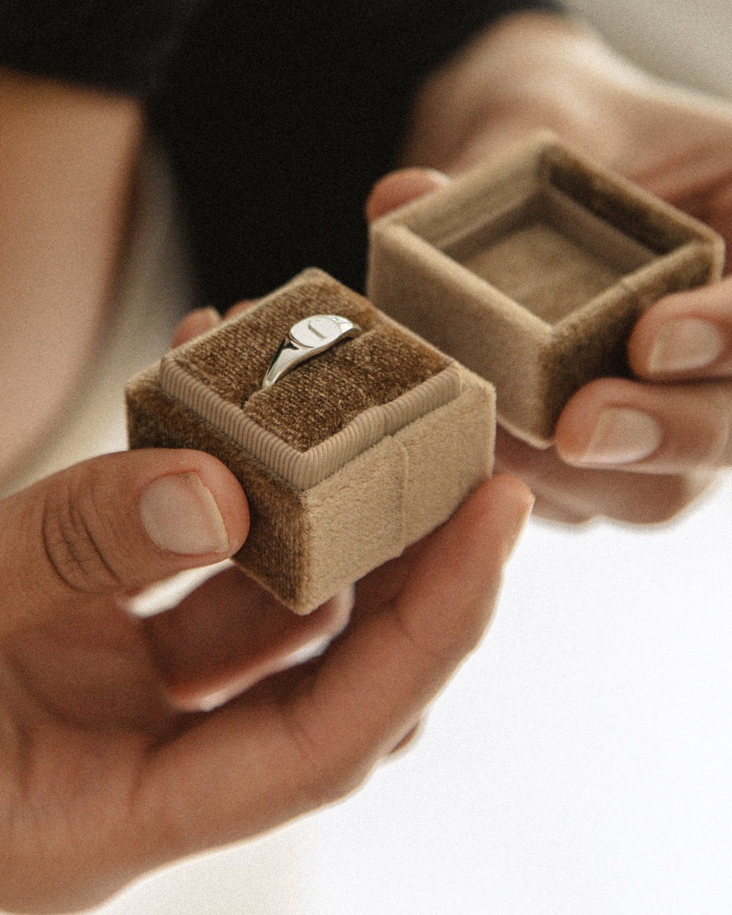 A Signet Ring with personalised engraving sits inside a beautiful velvet ring gift box.