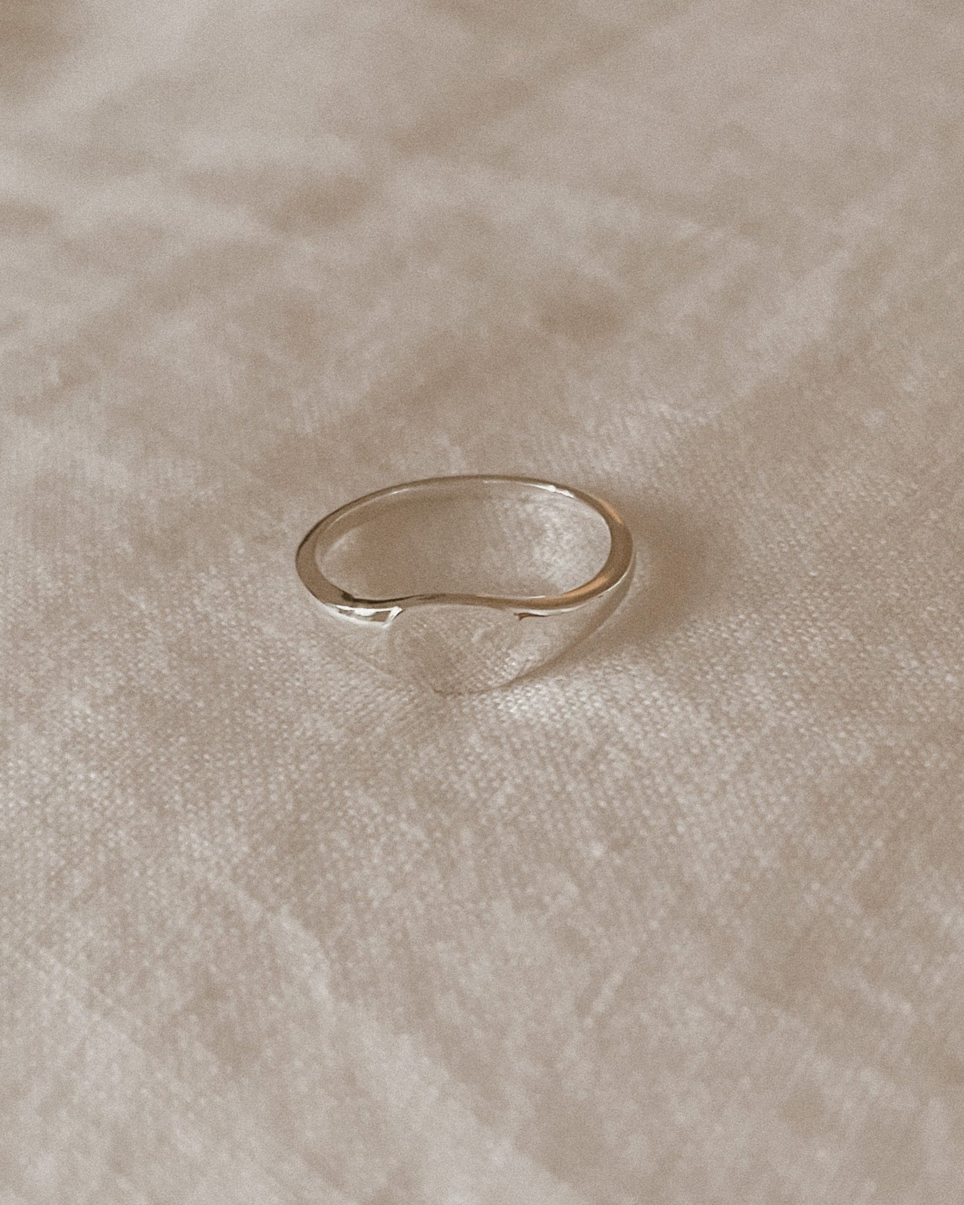 Sterling Silver signet ring in adult size.