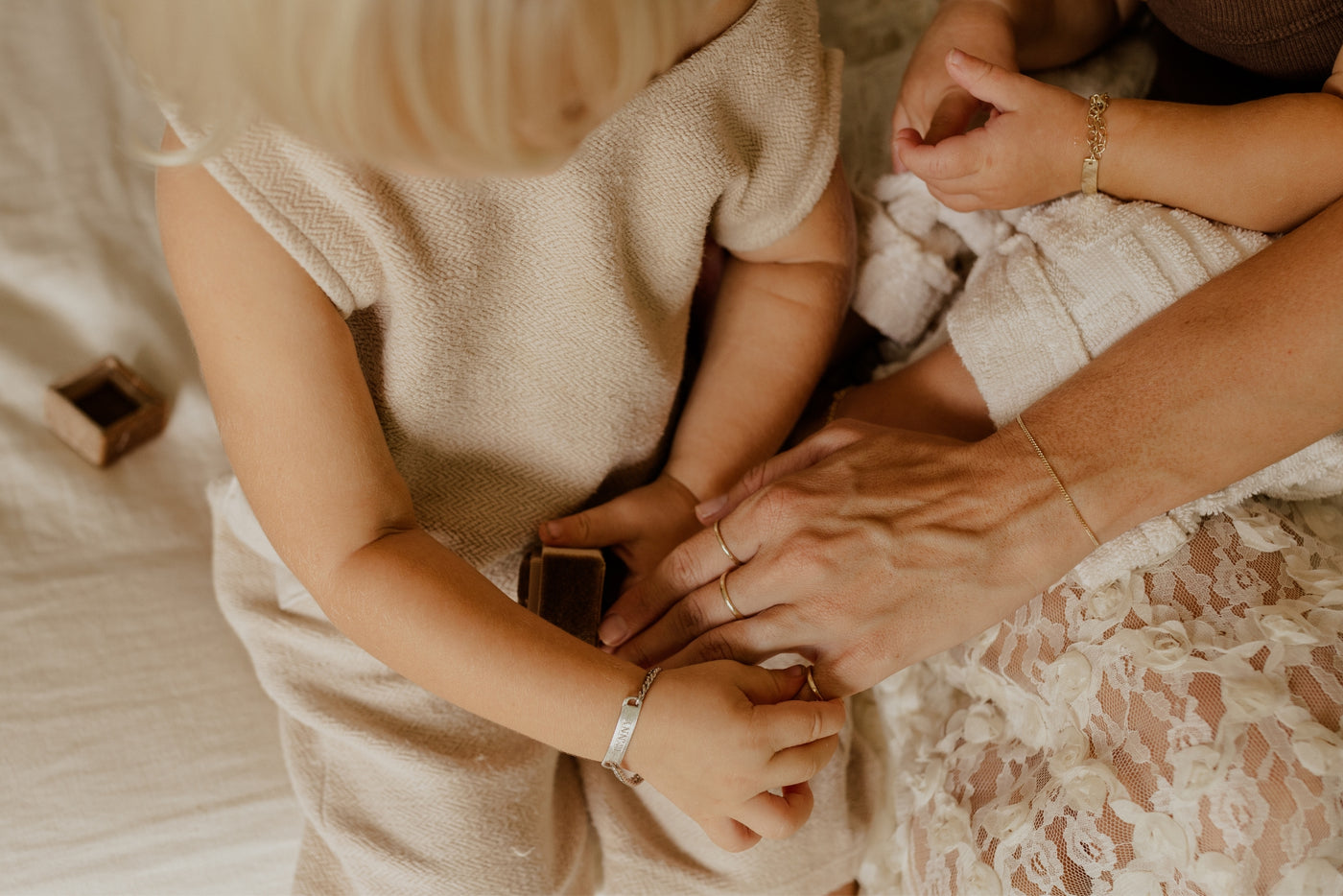 signature men's ring being placed on a dad's hand by his daughter