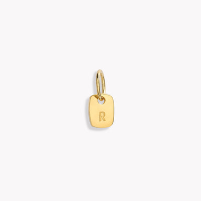 A mini rectangular initial pendant with the letter R on it. Timeless and meaningful personalised pendant.
