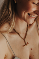 A Bluebird Co Fob Necklace with a chunky cuban link chain