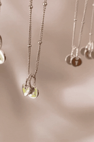 Bluebird co's Ball Chain necklace with mini sweetheart and initial pendants in silver. 