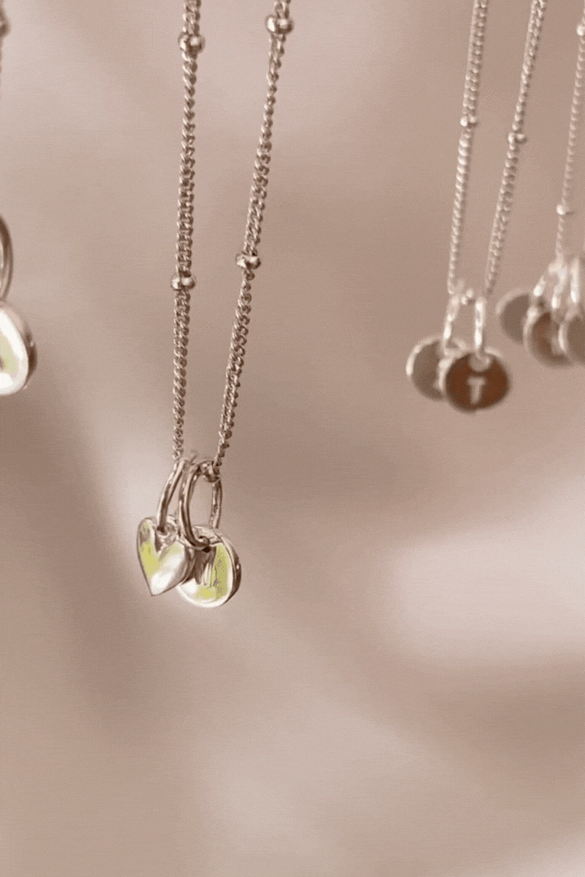 Bluebird co's Ball Chain necklace with mini sweetheart and initial pendants in silver. 