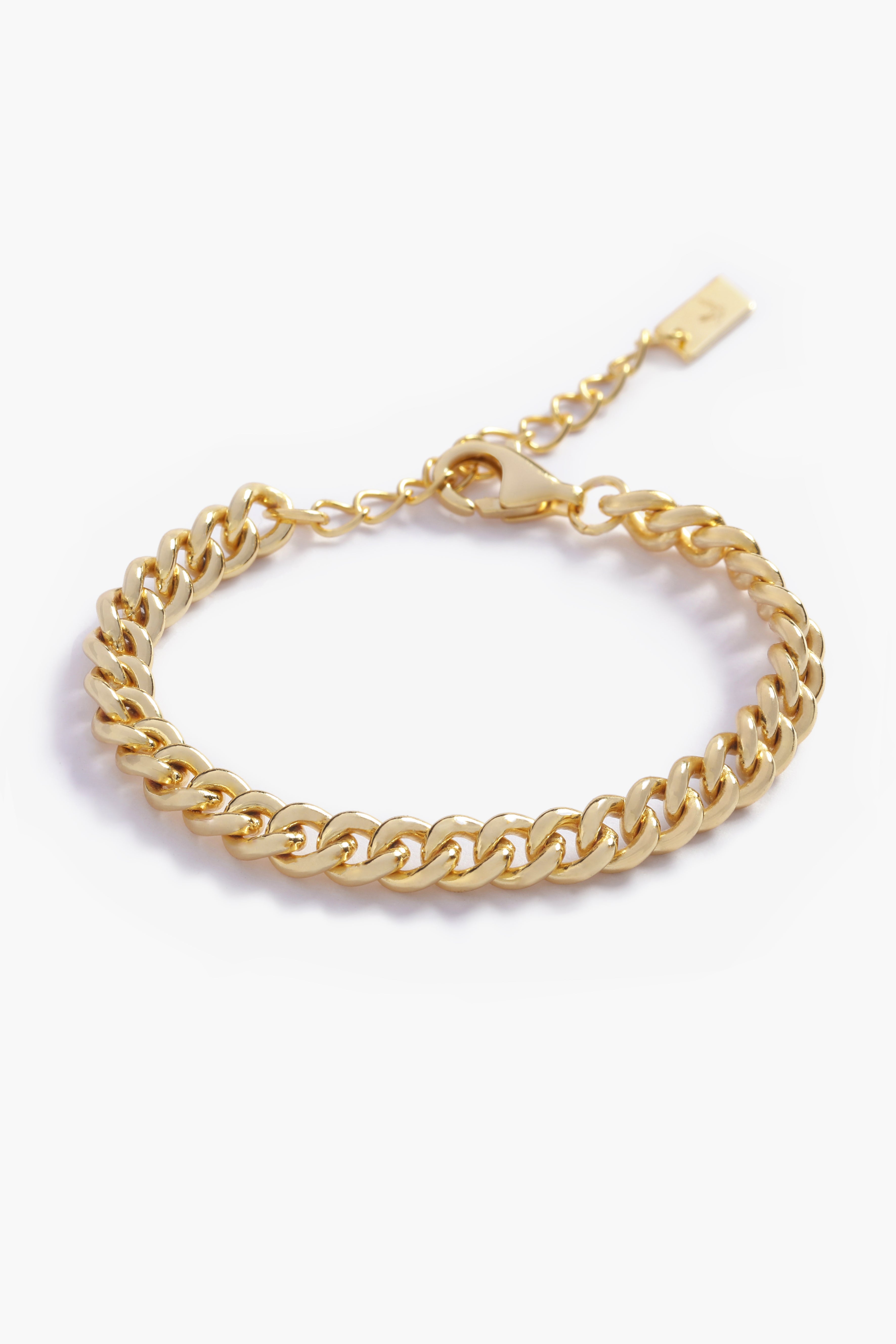 A gold chain bracelet photographed on a white background, crafted in elegant minimalist style.