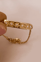 Bluebird Co's daisy bracelet in gold with daisy earrings. 