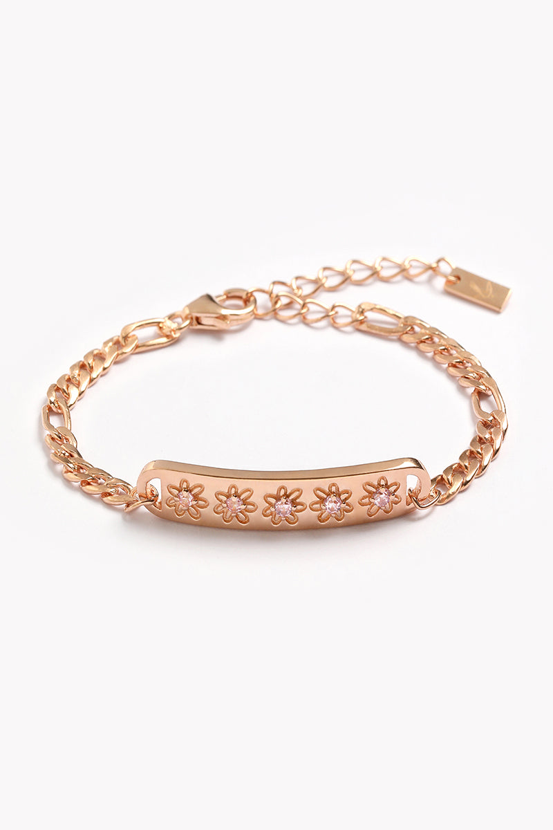 The Daisy Bracelet in Rosegold by Bluebird Jewellery, featuring five hand-drawn daisies with pink cubic zirconia centres, crafted as a feminine and floral fine jewellery piece.