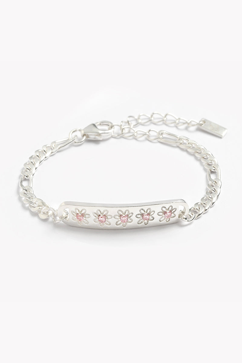 A delicate silver Daisy Bracelet from Bluebird Jewellery, showcasing five daisy motifs with soft pink centres for a charming, floral-inspired look
