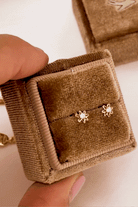 Bluebird Daisy Earrings Gold in velvet earring box. 