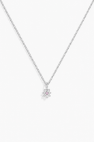 A delicate silver chain necklace with a small flower-shaped pendant featuring a tiny pink gemstone in the center, displayed against a clean white background.