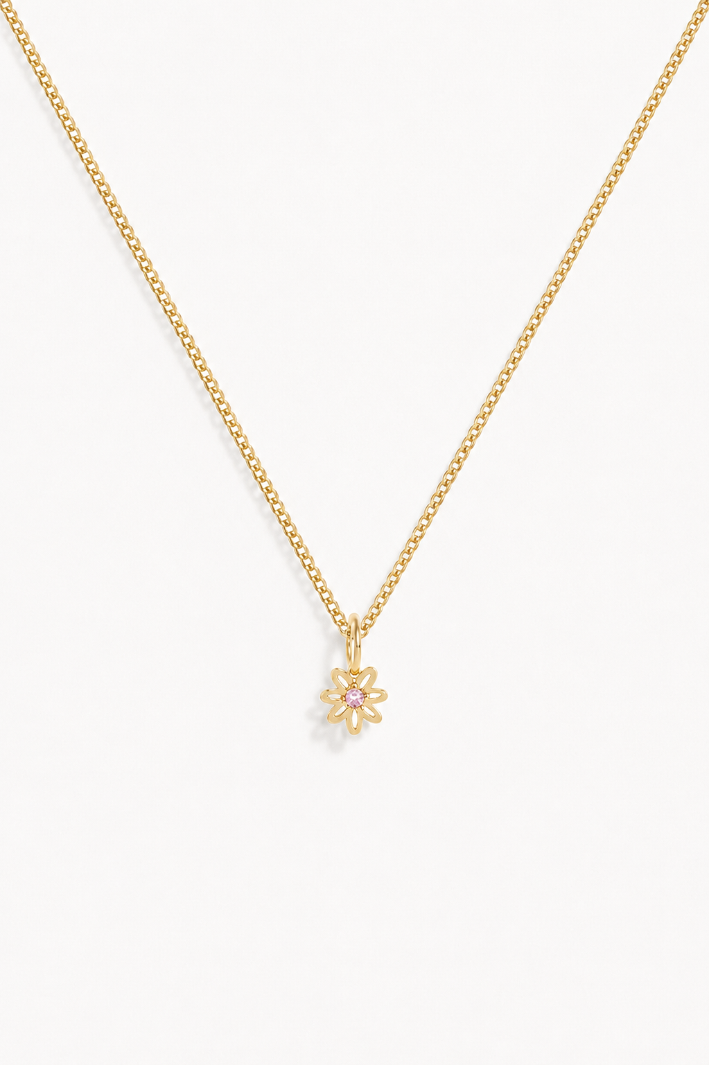 A beautiful dainty daisy pendant with a pink cubic zirconia at its centre is ono a fine curb necklace.  This necklace is perfect for adults and children and can be personalised with an initial pendant.