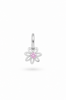 A silver flower-shaped charm pendant featuring a small pink gemstone in the center, suspended from a silver bail, shown against a plain white background.