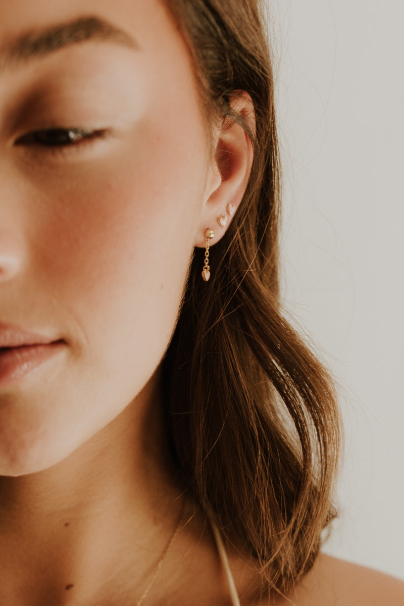 Everyday-friendly Darling Drop Sterling Rose Gold Earrings worn in a stacked style with matching studs.