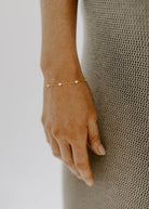 The Darling Heart Bracelet in gold by Bluebird Jewellery, featuring five petite hearts along a delicate chain, crafted as an elegant and timeless piece.