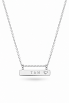 A silver bar necklace with engraving