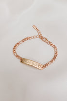 A Darling Bracelet in rose gold has personalised engraving of a child's name on the front of the ID bracelet.  This is a meaningful gift for a child with a small heart at the end of the engravable bar pendant on the bracelet.