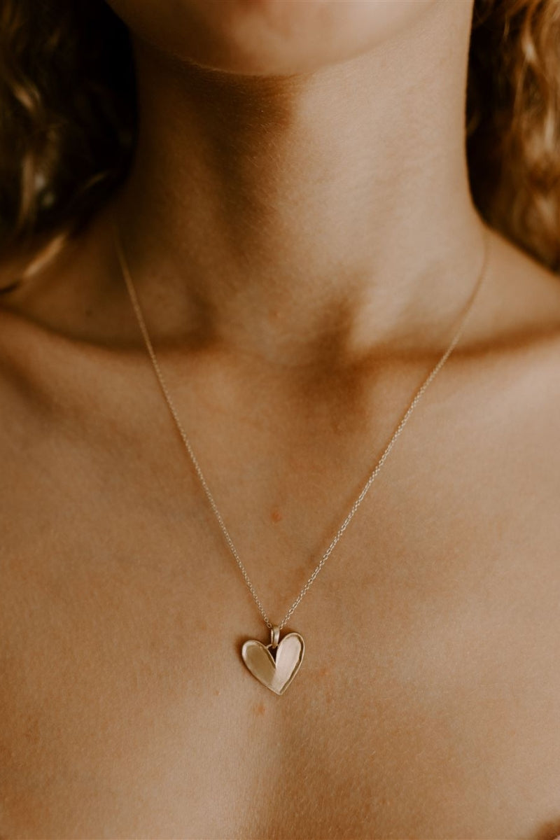 A teenage girl is wearing the Darling Necklace and it sits beautifully on her  décolletage.  It is a lovely statement necklace 