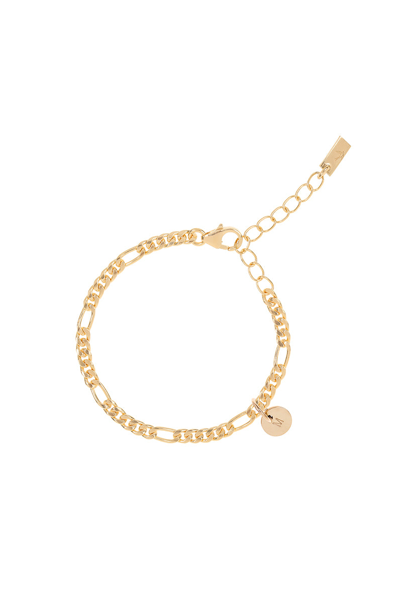 A Figaro Bracelet has a 9ct solid Gold Petite initial pendant on it by Bluebird Jewellery