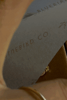 Bluebird Co 9ct gold initial pendants. 