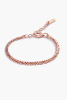 A close-up of The Lace Chain Bracelet, an elegant rose gold bracelet with delicate lace-like detailing and a refined minimalist design.