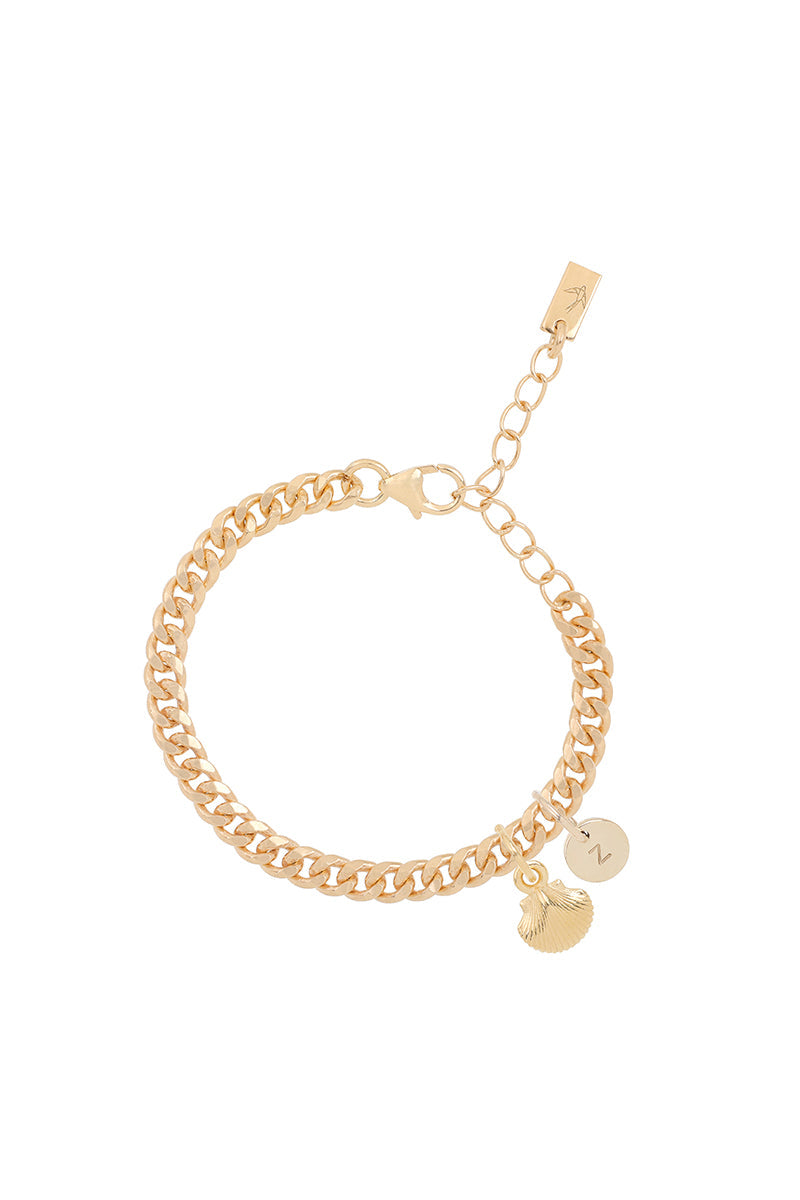 A gold Cuban Link Chain Bracelet featuring a mermaid shell charm and a solid gold initial pendant, crafted as elegant personalised jewellery by Bluebird Co