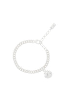 A delicate silver Lace Chain bracelet featuring a mermaid shell charm, crafted in fine jewellery style for a coastal-inspired look.